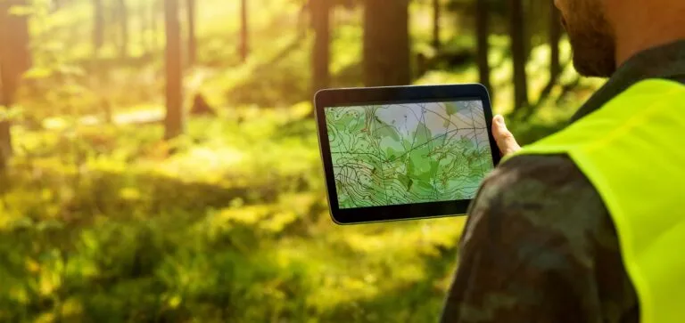 Man,Working,With,Topographic,Map,Data,On,Digital,Tablet,In